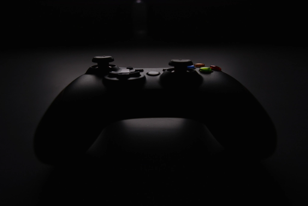 dark background photograph Xbox controller